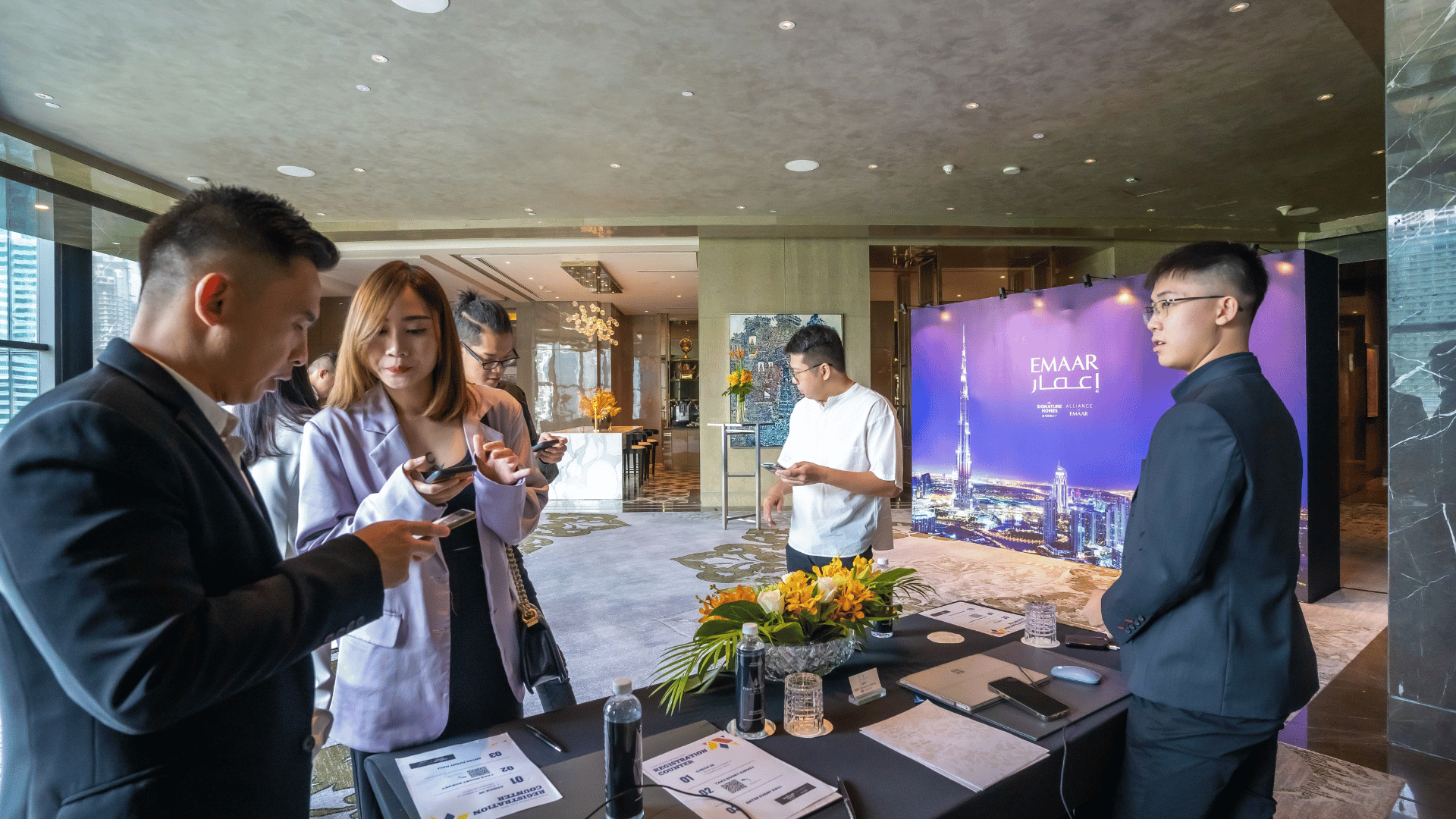 Participants checking in at the registration area before entering the Dubai Real Estate Expo 2023.