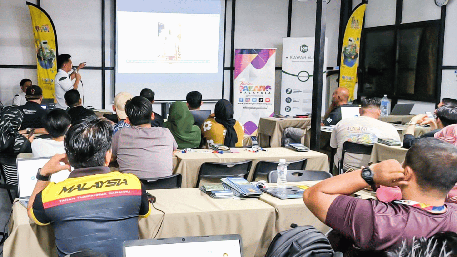 Participants returning to the training room to review and discuss the photos and footage captured during the day’s field activities.